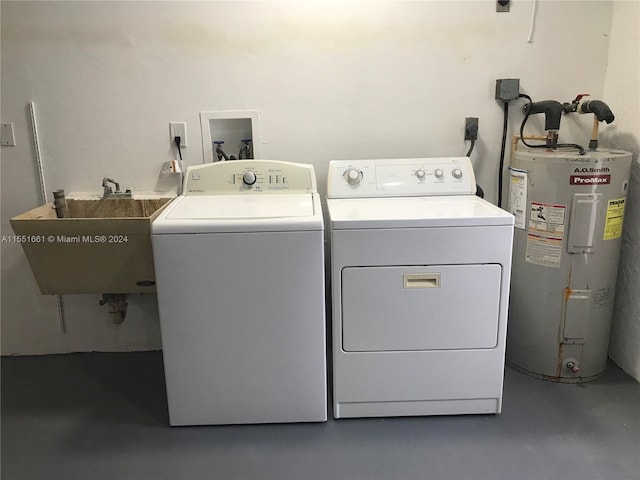 laundry area featuring hookup for a washing machine, electric dryer hookup, water heater, independent washer and dryer, and sink