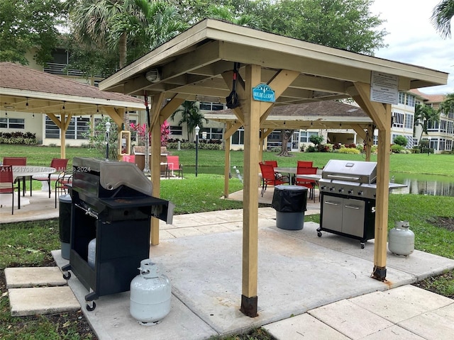 surrounding community featuring a gazebo and a lawn