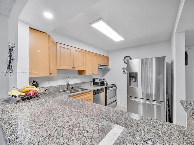 kitchen featuring dark stone counters, light brown cabinetry, sink, light tile patterned flooring, and stainless steel appliances