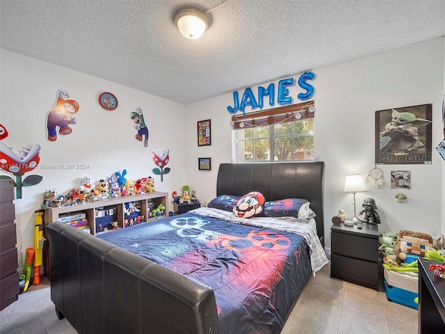 tiled bedroom with a textured ceiling