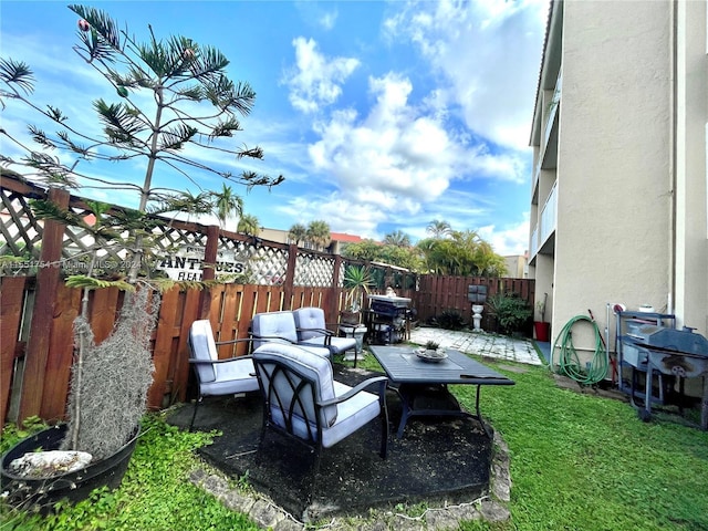 view of patio featuring a fenced backyard and a grill