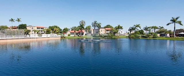 water view featuring fence and a residential view