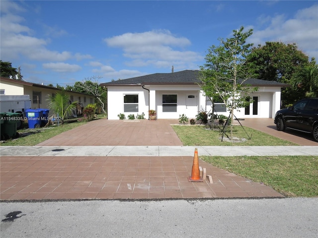 view of front of home with a front lawn