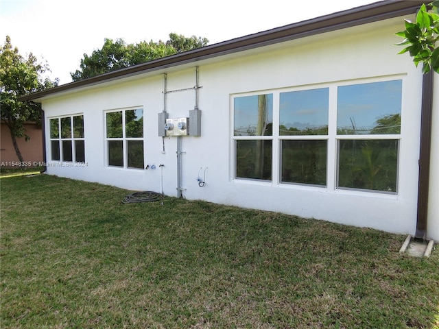 back of house with a yard