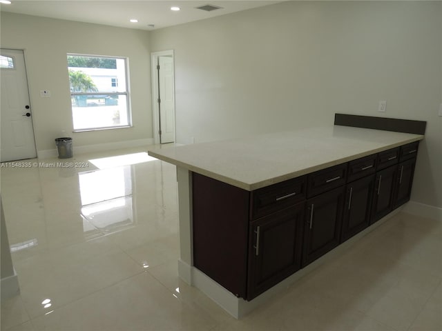 kitchen featuring light tile floors