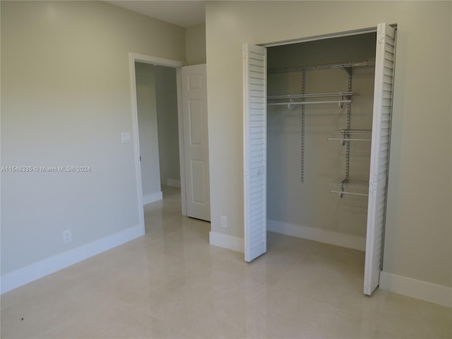 unfurnished bedroom with a closet