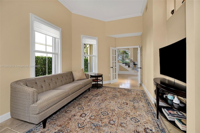 living room with crown molding and french doors