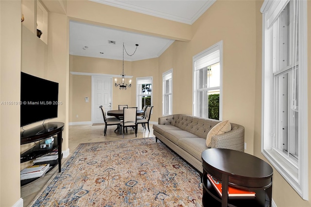 living room featuring a chandelier and crown molding