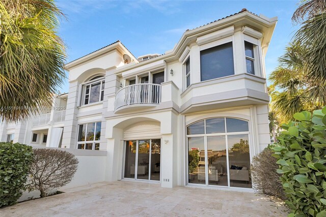 rear view of house featuring a balcony