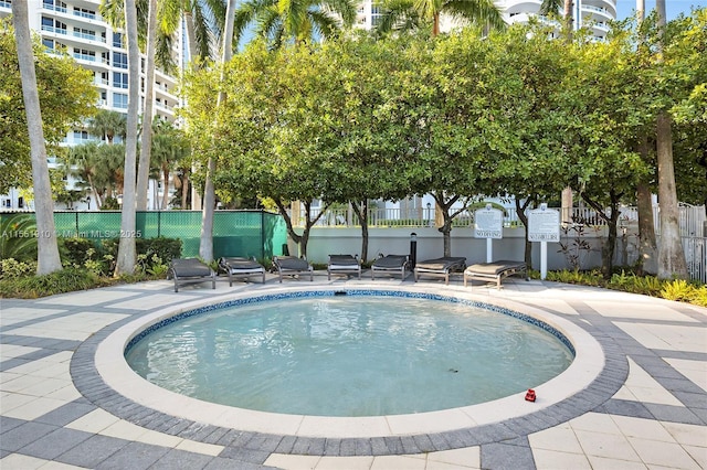 view of swimming pool with a patio