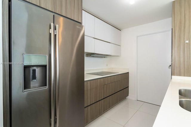 kitchen with white cabinetry, stainless steel fridge with ice dispenser, black electric stovetop, and light tile floors