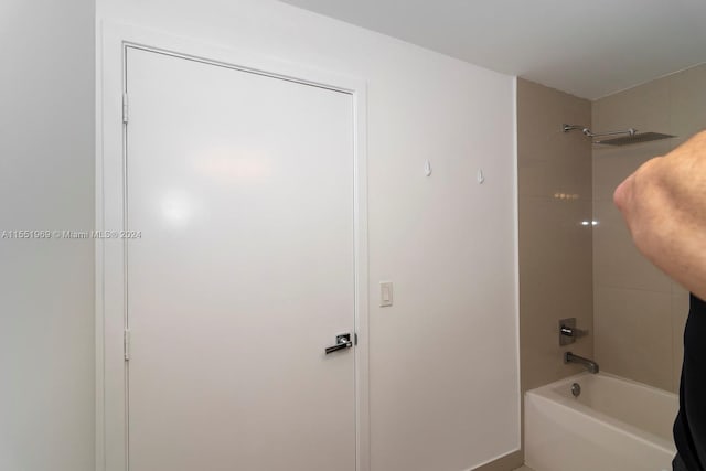 workout area with a tray ceiling and a wall of windows