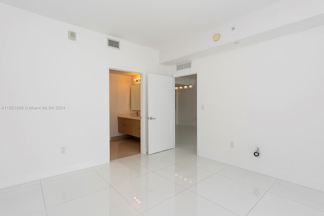 spare room with light tile flooring