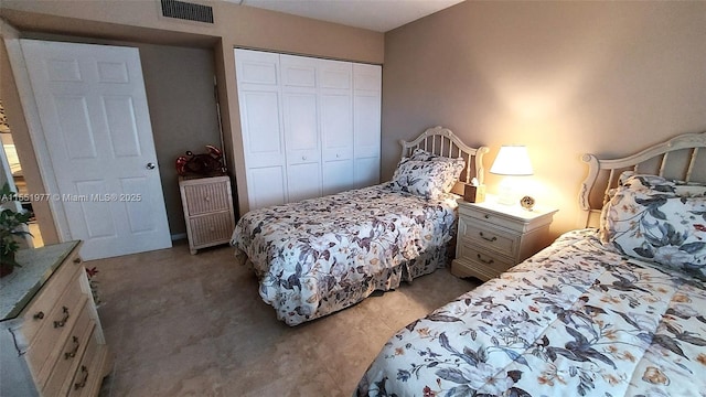 carpeted bedroom featuring a closet