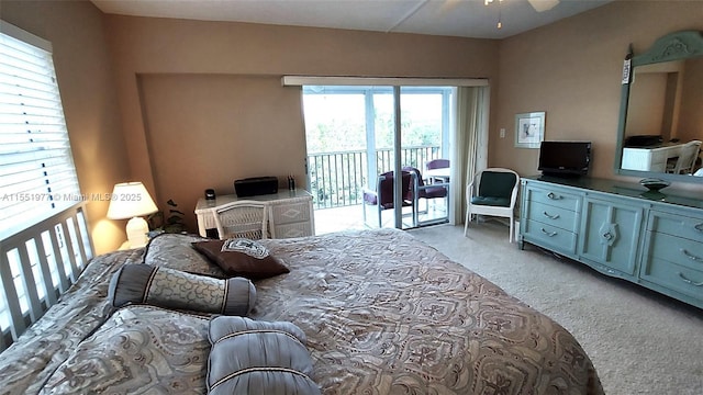 bedroom with access to exterior, light colored carpet, and ceiling fan