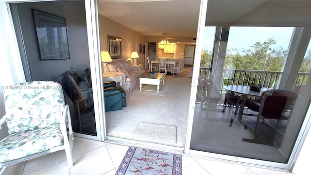 exterior space with ceiling fan and tile patterned flooring