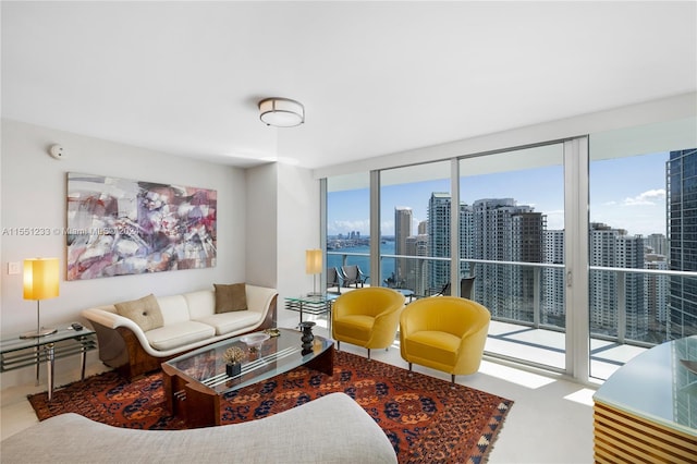 living room with a water view and expansive windows