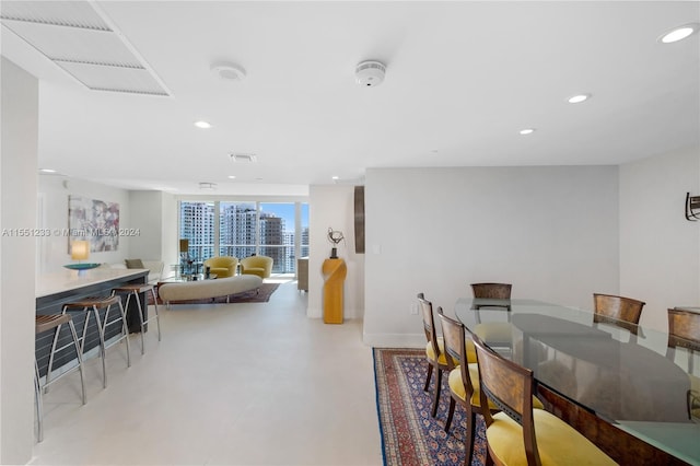 dining space with a wall of windows