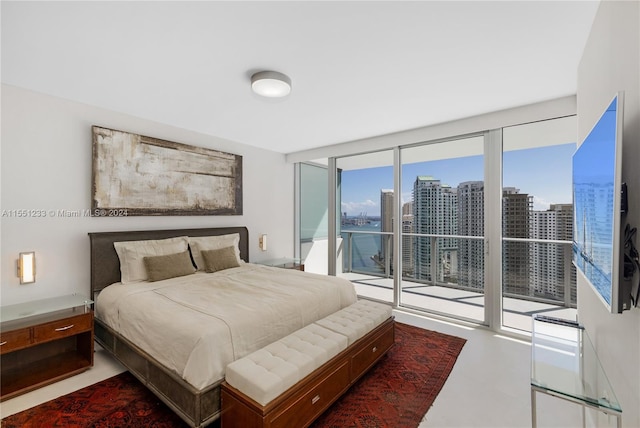 bedroom with access to outside and expansive windows