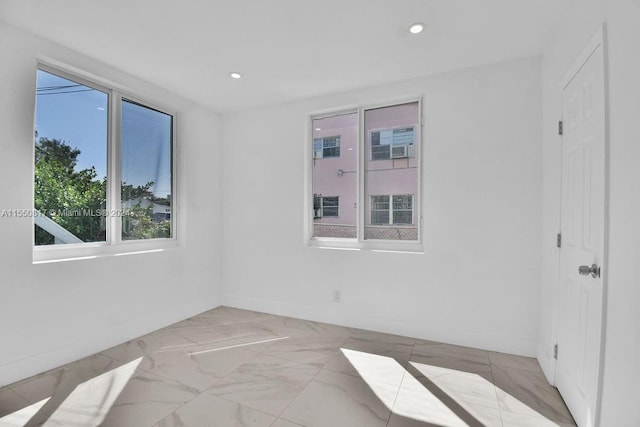 spare room featuring light tile floors