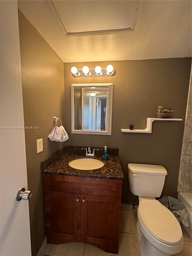 full bathroom featuring shower / bath combo with shower curtain, toilet, tile flooring, and vanity