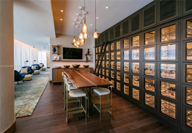 dining space featuring dark hardwood / wood-style floors and a chandelier