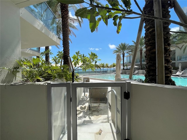 balcony featuring a community pool