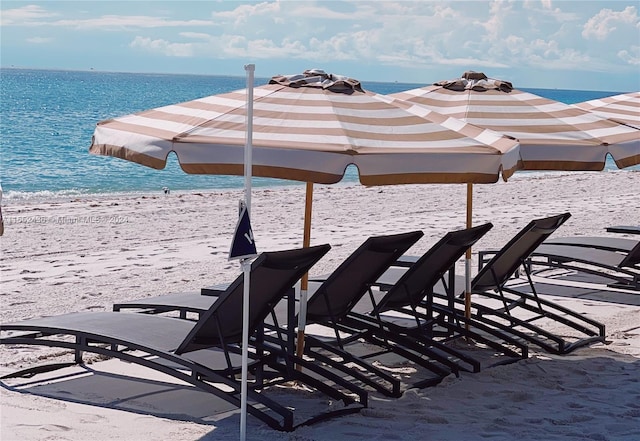 exterior space featuring a water view and a view of the beach