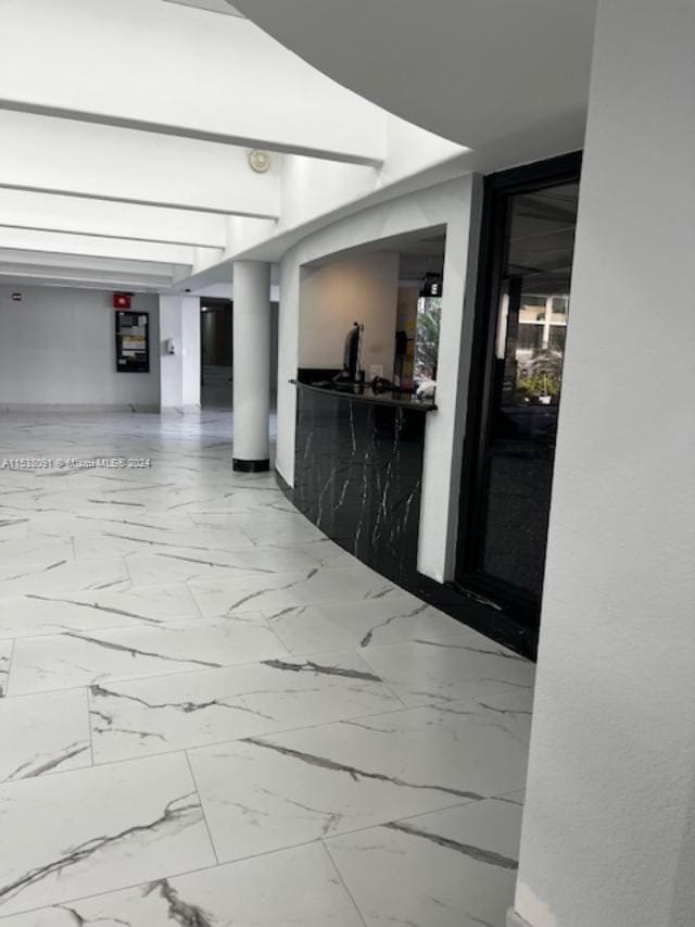 hallway with tile flooring