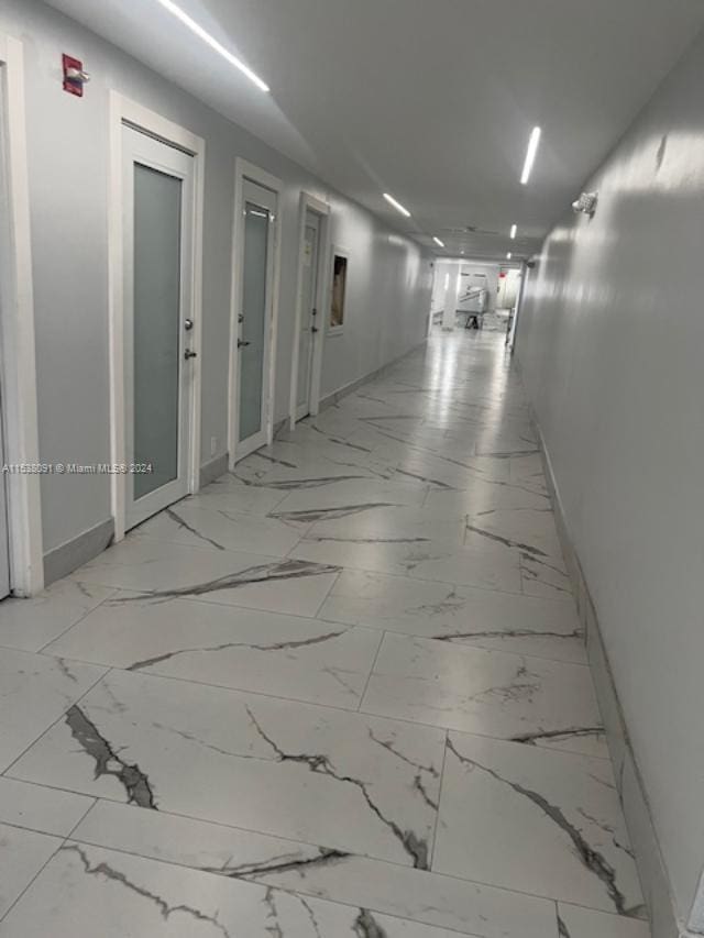 hallway with tile floors