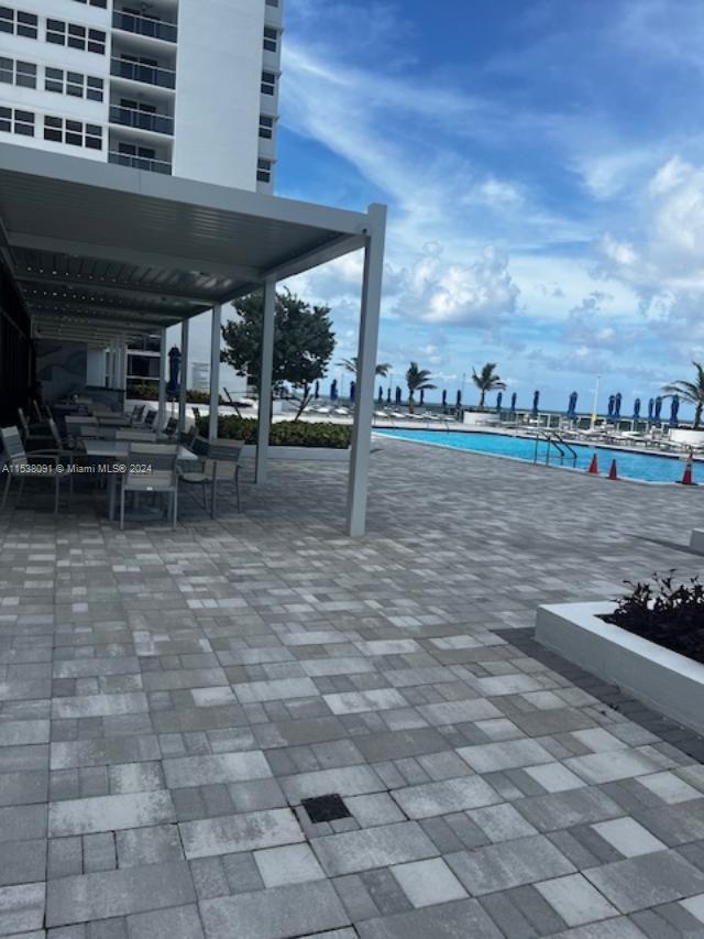 view of patio / terrace featuring a community pool