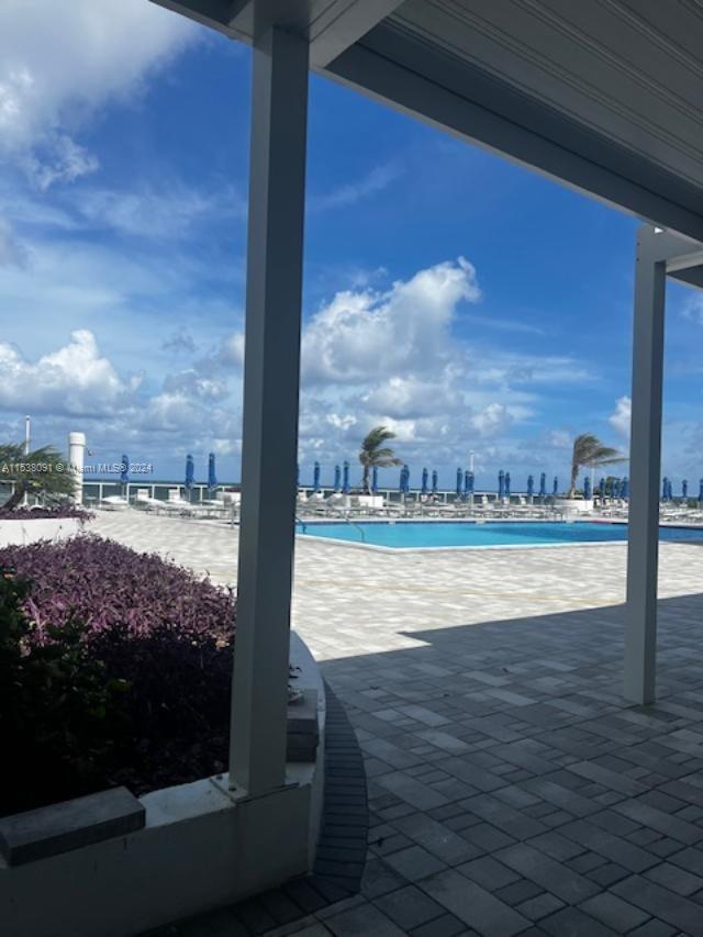 view of terrace featuring a community pool