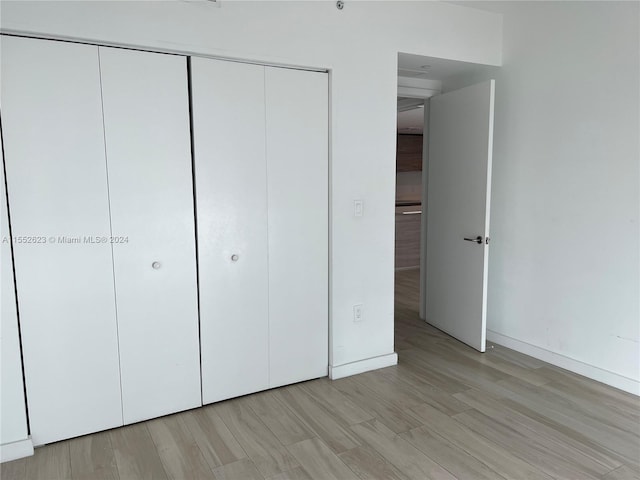 unfurnished bedroom with light hardwood / wood-style floors