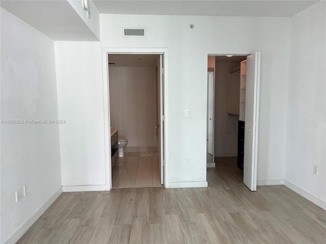 unfurnished room with light hardwood / wood-style floors