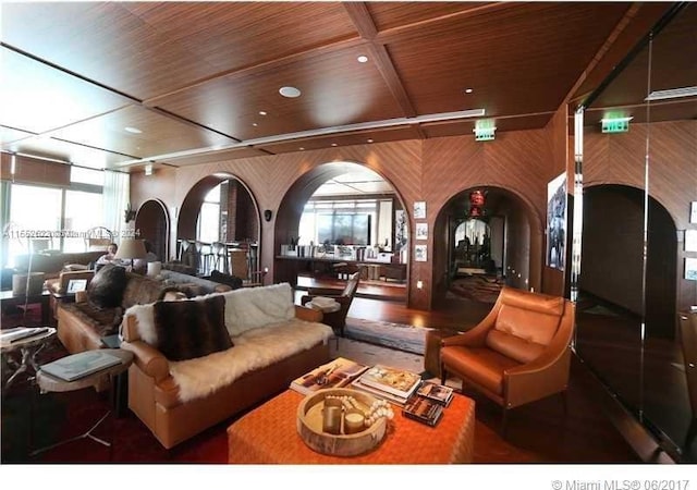 living room featuring coffered ceiling and wooden ceiling