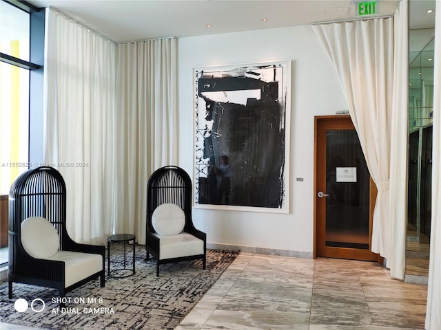 living area featuring light tile floors