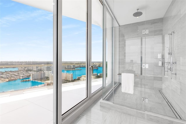 bathroom with a water view and tile floors