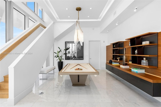 playroom with a raised ceiling, pool table, a high ceiling, and light tile flooring