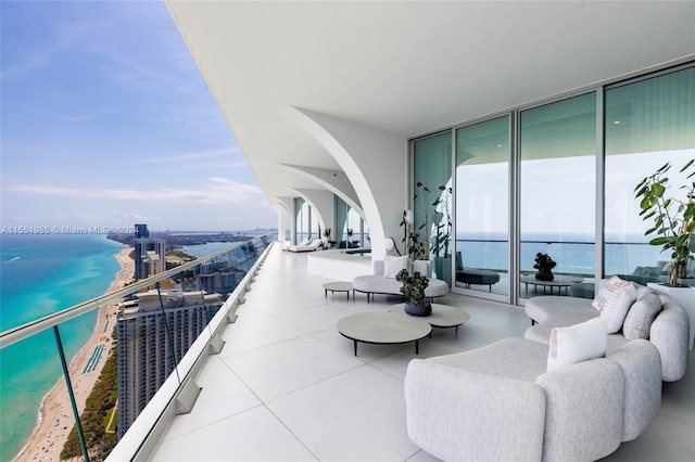 balcony with a water view and outdoor lounge area