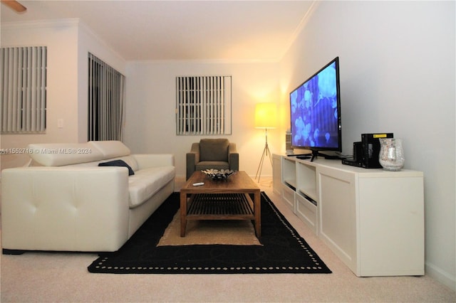 living room featuring light carpet, crown molding, and ceiling fan