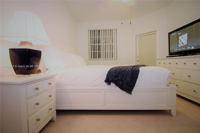 bedroom featuring light carpet and ceiling fan