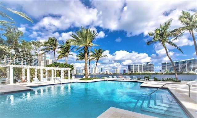 view of pool with a pergola and a patio area