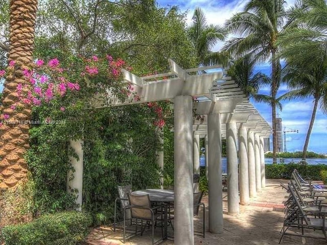 surrounding community with a pergola and a patio