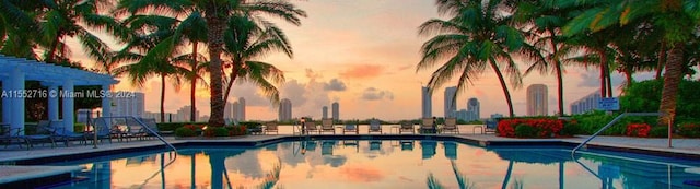 view of pool at dusk