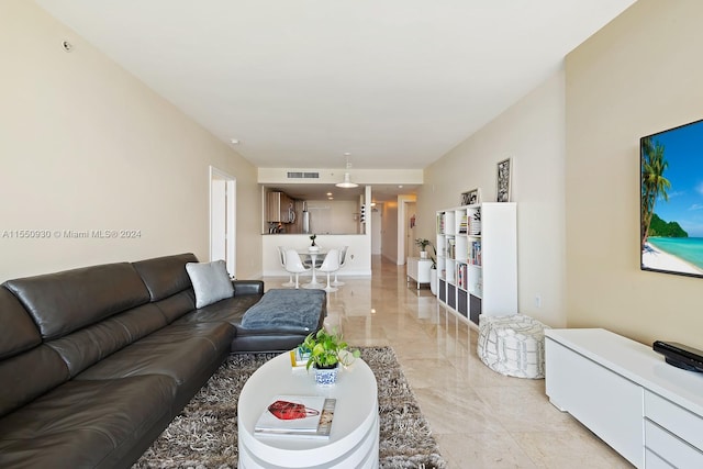 living room featuring light tile floors