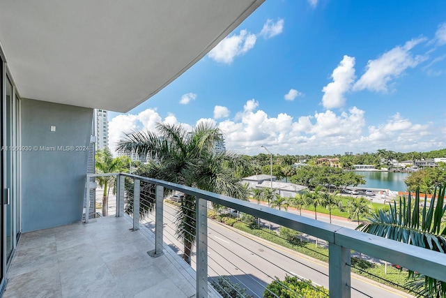 balcony featuring a water view