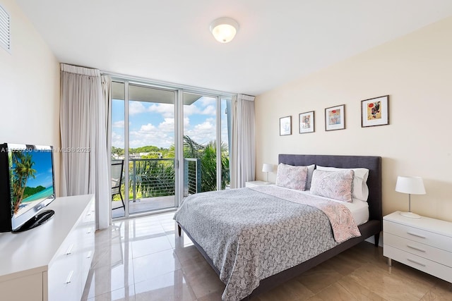 bedroom featuring access to exterior, visible vents, and expansive windows