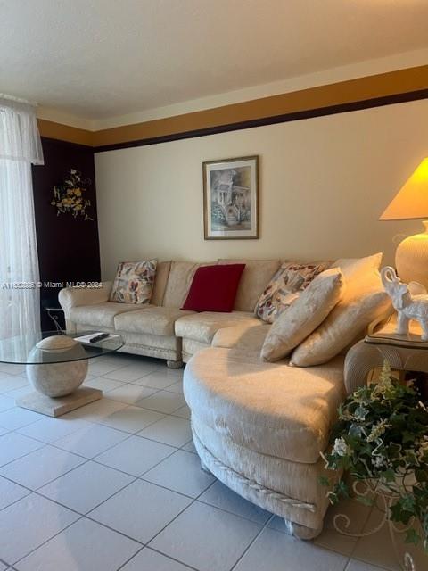 living room with light tile flooring