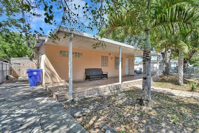 back of property with a patio area