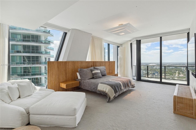 bedroom with access to exterior, light colored carpet, and multiple windows